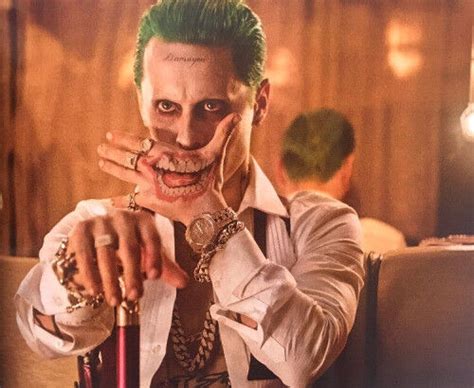 Particularly the stamp of "damaged" across his forehead. . Suicide squad joker hand tattoo